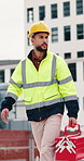 Construction, walking and man with toolbox on rooftop for building, installation and safety inspection. City, contractor and person with equipment for technician service, maintenance and repair