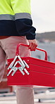 Construction, walking and man with toolbox in city for building, installation and safety inspection. Architecture, contractor and person with equipment for technician service, maintenance and repair
