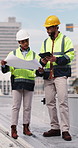 Construction, tablet and people with blueprint on rooftop for building inspection, layout and planning. City, team and workers with tech, papers and floorplan for engineering, maintenance and project