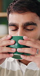 Man, coffee and drink in house with relax for reflection, break or thinking on lounge sofa. Person, eyes closed and perspective with beverage, caffeine or flavor on couch in living room of home