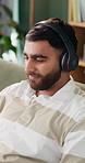 Headphones, man and freelancer in home, smile or songwriter with inspiration for audio melody. Remote work, music and happy person at apartment with online playlist, creative sound and song lyrics