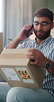 Man, phone call and update in home with box for ecommerce, communication and small business. Entrepreneur, talking and side hustle in house with tech for contact, online shop and stock delivery