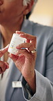 Talking, hands and doctor with pills for healthcare instruction, prescription and dose in hospital. Medicine bottle, healing and mature woman with drugs, explain treatment plan or medical advice