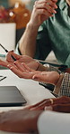 People, hands and meeting in creative agency with laptop, talk or research for graphic design project. Team, designer collaboration and computer in office with discussion, campaign planning or review