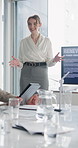 Businesswoman, presentation and screen in office with wind turbine, renewable energy or sustainability. Person, talk and monitor in workshop with windmill, eco friendly power generation and research.