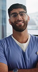 Face, nurse and happy man with arms crossed, wellness and confident with healthcare career and help. Medical professional, portrait and person with glasses, smile and health services in hospital
