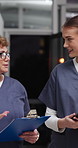 Night, nurse and intern in hospital with conversation, clipboard or tablet for medical research. Late, people and healthcare worker walk with tech, checklist or manager tips for internship at clinic.