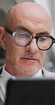 Night, businessman and glasses in office with tablet, research and deadline for financial investment. Bokeh, mature person and reading in firm with tech, planning and work late for funding proposal.