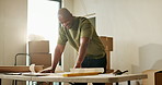 Man, new home or blueprint for renovation, smile and real estate with inspiration for layout design. Black person, document or architectural planning at house, building upgrade or remodeling property