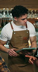 Waiter, order and people at pub with tablet, menu selection and discussion for customer service. Bartender, serving and friends at bar with digital, beverage options and recommendation for happy hour
