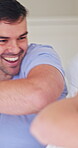 Love, man or couple in house with pillow fight, bonding or happy moment in morning routine. Laugh, energy or people with cushion battle, playful connection or romantic game in healthy relationship.
