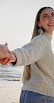 POV, woman and couple holding hands by beach with adventure, bonding together and sunshine on holiday. Flare, person and walk by ocean with relationship commitment, travel vacation and happy on trip.