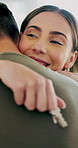 Hug, keys and couple in new home on date with bonding, support or comfort with property investment. Happy, marriage and man embracing woman for celebration of real estate together in apartment.