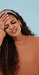 Mistake, face and woman in studio with thinking, error and wrong choice in decision making. Failure, portrait or person on blue background with disappointment, frustration or regret in reflection.