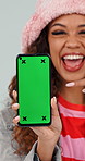 Happy, green screen and face of woman with phone for social media, texting and chatting on app. Pointing, technology and portrait of person with cellphone for email, contact or connectivity by space.
