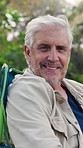 Face, vacation and senior man on camping chair for relax, travel and happiness on outdoor break. Tourism, holiday and elderly person in nature with peace in retirement, calm and smile in Finland
