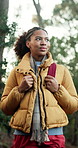 Thinking, hiking and woman in forest for adventure, holiday view and exploration for tourism. Sightseeing, trekking and African person in nature for trip, walking or travel with reflection on journey