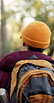 Walking, hiking and man with backpack in nature for adventure holiday, outdoor exploration and trip. Back, trekking and person in woods for eco tourism, sightseeing and travel for winter vacation