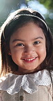 Happy, face and nature with girl in park for outdoor childhood, growth or fashion in sunlight. Portrait, child or kid with smile, clothing or cute outfit for summer holiday, development or weekend