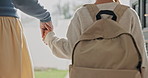 Mother, holding hands and kid at house with backpack, support and back to school for education. Woman, walk or front door for departure with daughter, morning routine or bonding together for learning