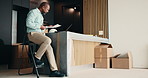 Laptop, black man and architect in office with documents for planning building, maintenance or repairs. Computer, typing and contractor with title deed paperwork for approval on home renovation.