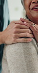 Holding hands, physiotherapist and old woman with talk, assessment and smile for wellness at clinic. People, recovery and discussion with comfort, healthcare service or happy with support for healing