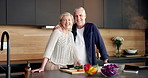 Face, home and old couple with vegetables, cooking and confidence with tablet, recipe and hug. Support, embrace and senior people in kitchen, skills and ingredients with meal prep, health and food