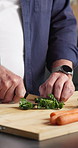 Hands, cooking and spinach on chopping board for diet, healthy nutrition or wellness in kitchen. Slice vegetables, man and meal prep with knife at home, organic food and vegetarian ingredients