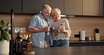 Coffee break, phone and old couple in home for morning, conversation or laugh together in kitchen. Love, smile and elderly man with woman for funny joke with social media, relax and chat in apartment