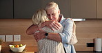 Love, hug and elderly couple in home for support, comfort or bonding together in kitchen. Smile, commitment and senior man with woman for romance with marriage, anniversary and embrace in apartment
