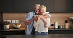 Face, hug and elderly couple in home for support, comfort or bonding together in kitchen. Smile, portrait and senior man with woman for romance with marriage, anniversary and embrace in apartment
