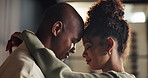 Hug, happy and couple with forehead touch in home for bonding, connection or marriage on weekend. Smile, love and man embracing woman for commitment, trust and care in relationship at apartment.