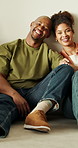Face, couple and relax at house with smile, love and bonding together for commitment. Portrait, African people and laughing in lounge with partner, funny joke and connection for healthy relationship