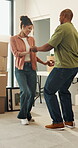 Real estate, fun or couple in lounge with dance, fresh start or happy moment in dream house. Property, bonding or people with playful groove, housing success or moving achievement for new homeowners.