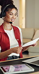 Woman, paperwork and headset in home with laptop, data analysis and market research for remote work. Virtual assistant, person and talk in house with tech, consultation and graphs for stats document.