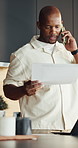 Man, paperwork and phone call in home with remote work, discussion or financial advisor for business. Black person, conversation and contact in house with tech, finance documents or opinion for audit