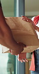 Hands, bag and food delivery by home front door for ecommerce, convenience and online shopping. People, package and courier guy with customer for distribution, parcel or logistics service at house