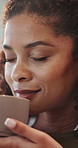 Smile, woman and coffee in home with aroma, caffeine scent and calm morning for stress relief. Thinking, person and smell at house with warm beverage, fragrance and nostalgia memory for weekend break