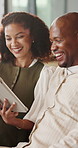 Home, black couple and high five with tablet for chat, online message and video for laughing in lounge. Gesture, man or woman with tech for texting, social media or funny comment for bonding together