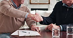 Clipboard, handshake and business men in home for finance deal, negotiation or contract for investment. Documents, partnership and male financial advisor shaking hands with customer in house.