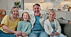 Face, parents and kids laughing in family home with love, happiness and connection together. Portrait, mother and father with children on sofa in living room, care and bonding with funny sisters