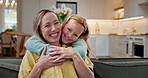 Face, mother and child in home with hug, smile and bonding together for connection on weekend break. Happy, woman and daughter in living room with embrace, family wellness and love with affection.