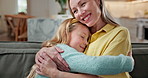 Happy, mother and daughter in home with hug, care and bonding together for connection on weekend break. Family, woman and child smile in living room with embrace, wellness and love for affection.