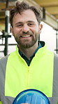 Helmet, happy and face of man on construction site, building project and renovation outdoor. Laugh, engineering and portrait of person with ppe for infrastructure, development and architecture
