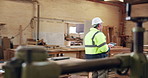 Woodworking, supervisor and man with tablet in workshop, manufacturing or quality control on website. Carpentry, inspection and mature person with tech in warehouse, walking and inventory management