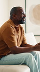 Relax, sofa and black man watching tv in home for online subscription, streaming or entertainment. Happy, male person or smile with remote on living room couch for movie, series or channel in house