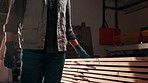 Carpentry, material and hands of man with inspection for manufacturing, furniture repair and walking. Workshop, carpenter and person with planks, wood and timber for woodworking and lumber production