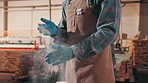 Carpentry, done and hands of man with sawdust for manufacturing, furniture repair and cleaning. Workshop, carpenter and person with gloves, dust and timber for woodworking and lumber production