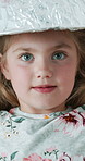 Hat, education and child in house with project, assignment or homework for knowledge and learning. Portrait, growth and girl with science headwear for development, research or innovation in apartment