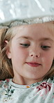 Girl, foil and homework with project for science with learning, smile and excited for progress. Child, happy and education with metal cap, development and experiment for fun with lightbulb in house
